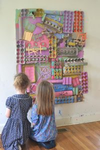 Kids make and paint a giant, 3D collage from recycled materials.
