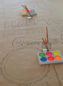 Make a birthday banner for your child for their birthday and have everyone at the party paint it!