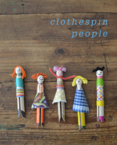 Kids make people from wooden clothespins.
