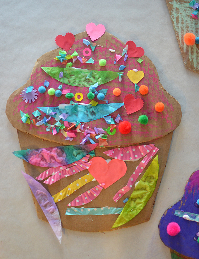Children make giant cardboard cupcakes with oil pastels and collage, inspired by the artist Wayne Thiebauld.
