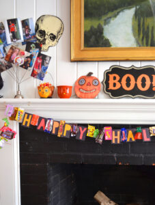 Make your own candy wrapper garland for a fun and sweet Halloween decoration.