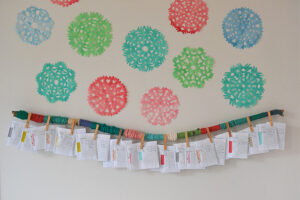 Make an advent calendar with yarn and a big stick to hang on your wall.