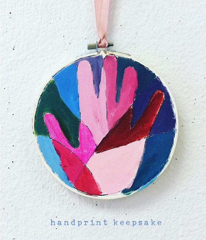 Children use warm and cool paint colors to make this handprint keepsake.
