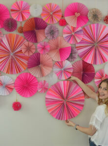 Make a photo backdrop wall with paper pinwheels, big and small.