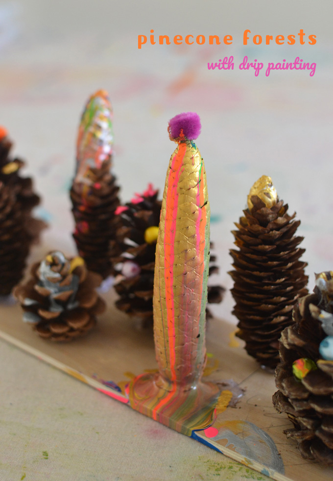 Kids use a drip paint technique to embellish pinecones and create a drippy forest.