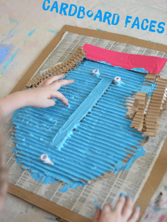 Kids created faces from corrugated cardboard and paint.