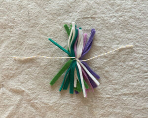 Make pom-poms from small strips of felt, then tie to wire to make a crown.