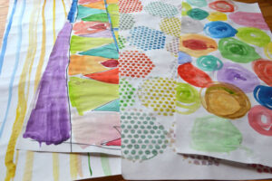 Homemade wrapping paper using watercolors, made by kids!