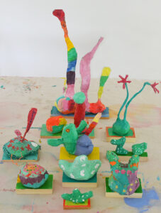 Children make paper mâché sculptures inspired by the artist duo Chiaozza.