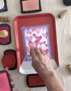 Make Valentine's cards with homemade stamps made with craft foam, corks, and lids.