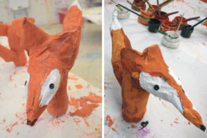 Paper mache foxes made by kids.