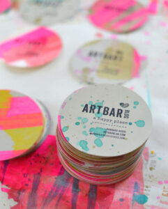 Handmade Business Cards using rubbers stamps, watercolor, and a round paper punch.