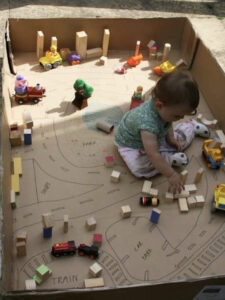 Transform a giant box into an imaginary play world for little kids.