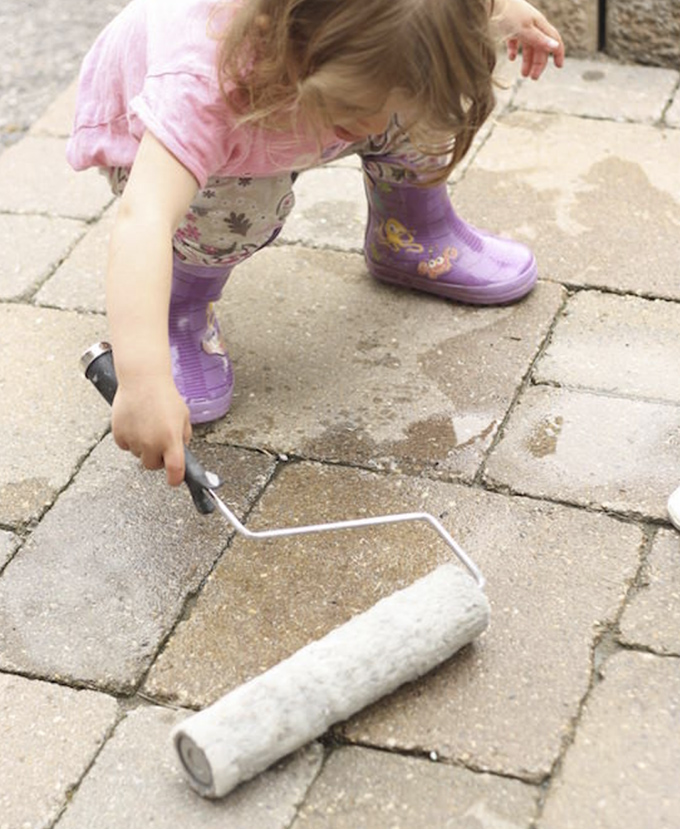 Get out big brushes and rollers and let your kids paint on the stone with water.