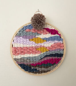Doodle weaving in a round embroidery hoop.