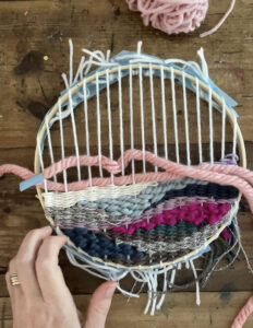 doodle weaving with thick and thin yarns, using tape at the ends of the yarn instead of a needle