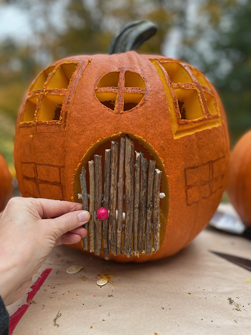 Making the twig door for the pumpkin cottage