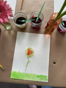 Flower still-life painting by young child using liquid watercolor.