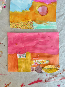 Mixed-media collage with tempera paint, finished on a table.